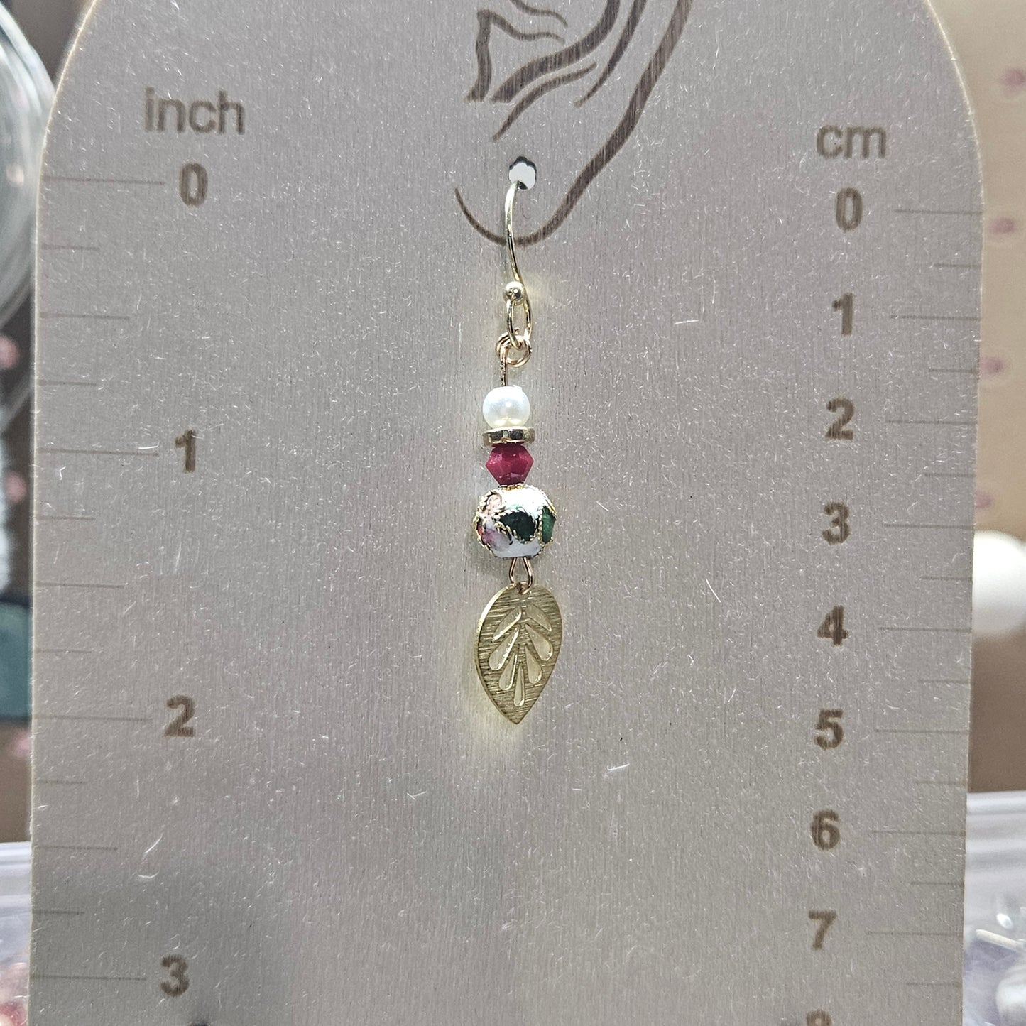 Gold and red earrings